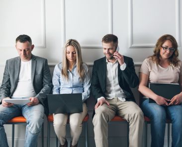 group-of-creative-people-sitting-on-chairs-in-wait-2024-09-22-15-19-44-utc (1)
